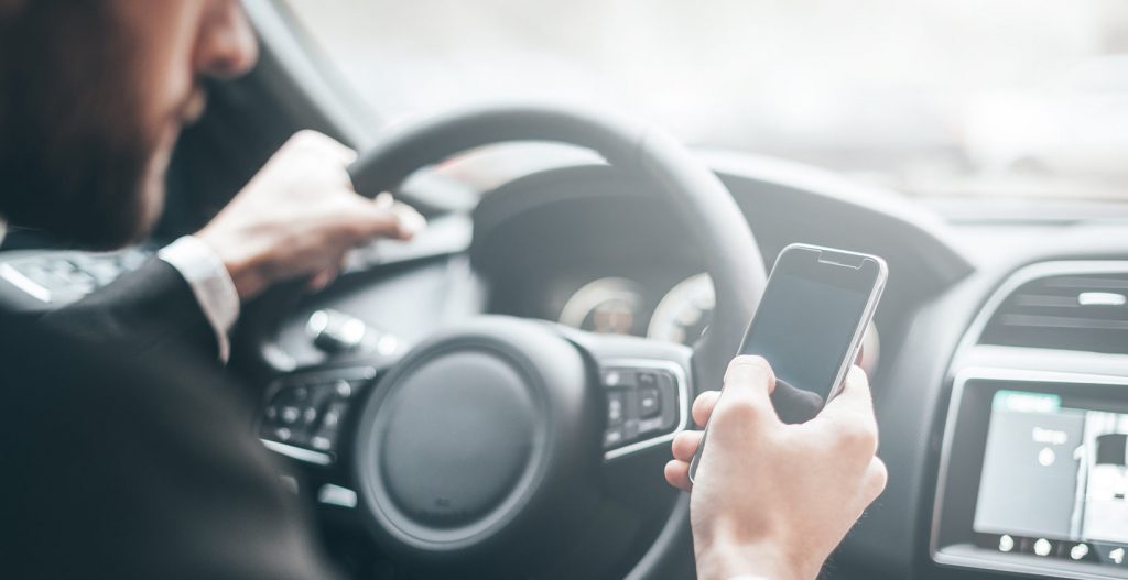 Using a Mobile Phone While Driving - Moore Motoring Law, Nottingham, UK